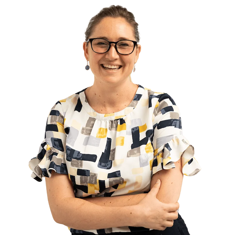 Person in patterned top smiles to camera