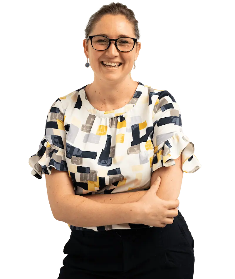 Person in patterned top smiles to camera