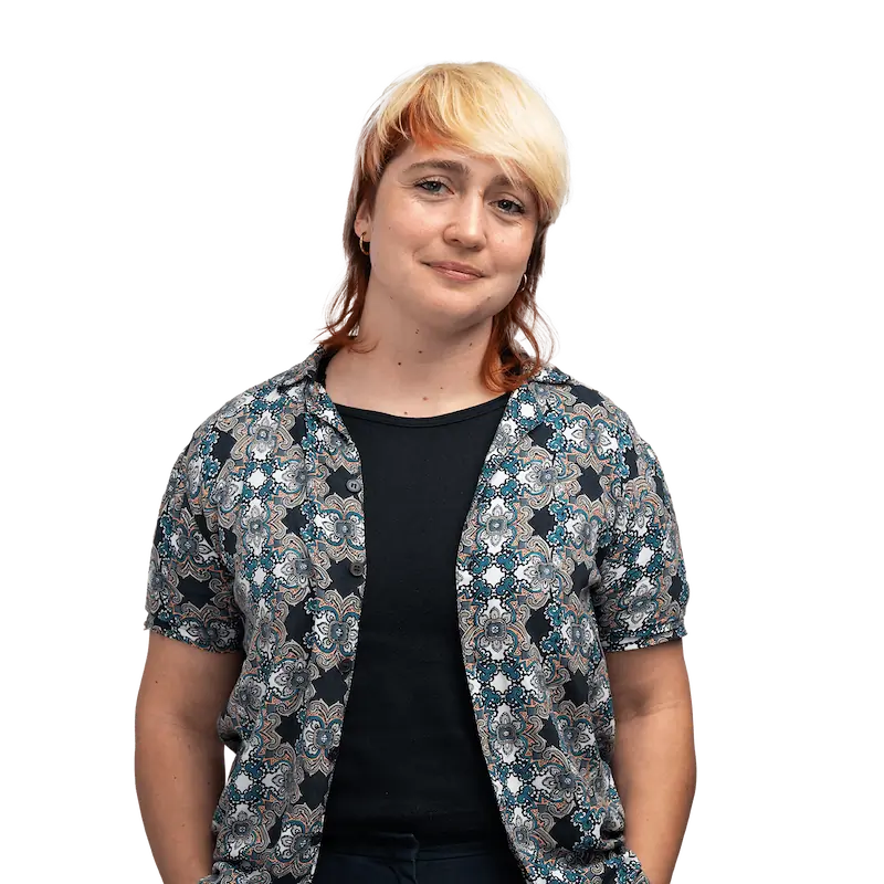 Londoner in patterned top smiles for camera