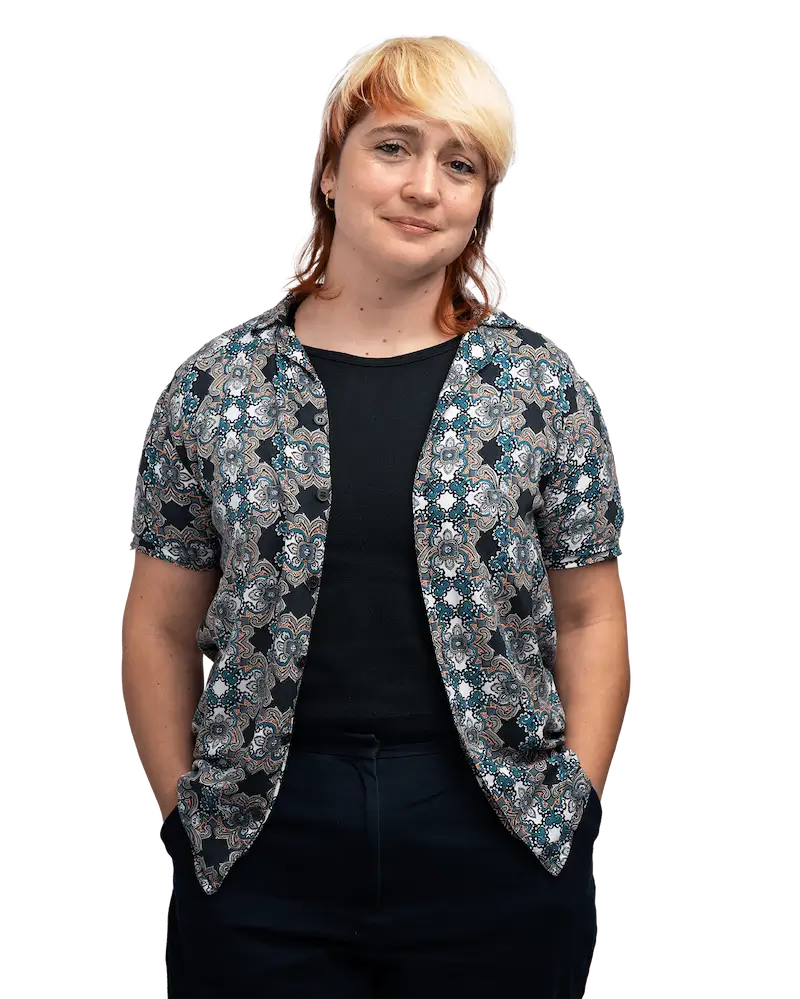 Londoner in patterned top smiles for camera